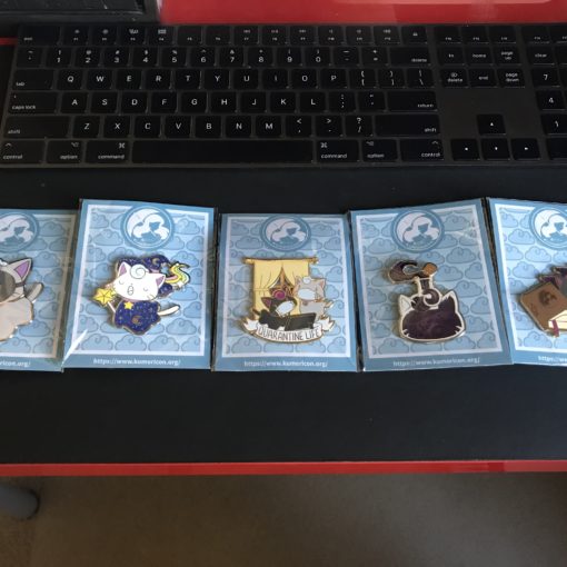 Photo of 2020 Kumoricon collectable pins.