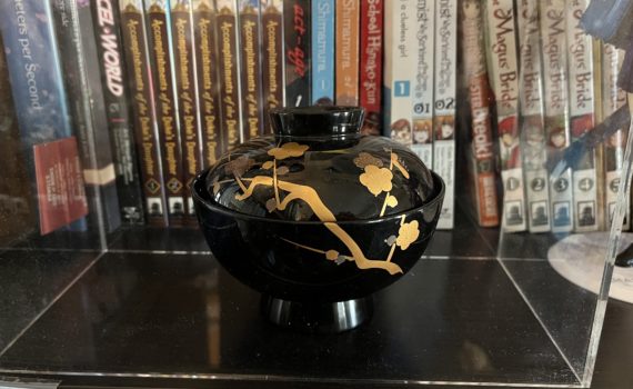 Photo of a black lacquerware bowl with a plum blossom design.