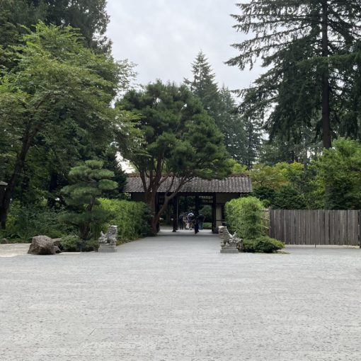 Photo of the Cultural Crossing courtyard at the Portland Japanese Garden after a short drizzle during evening Members' Hours.