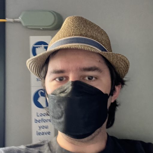 Selfie taken onboard a TriMet FX bus from the front seat behind the operator.