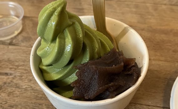 Photo of a matcha soft serve with adzuki (red bean paste) from Behind The Museum Cafe.