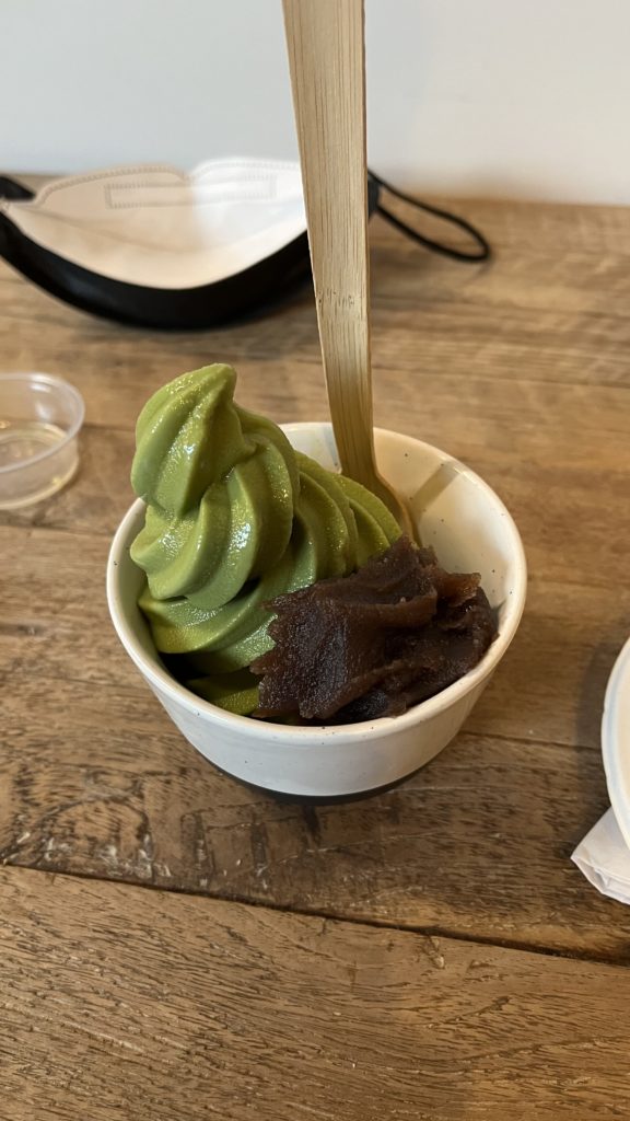 Photo of a matcha soft serve with adzuki (red bean paste) from Behind The Museum Cafe.