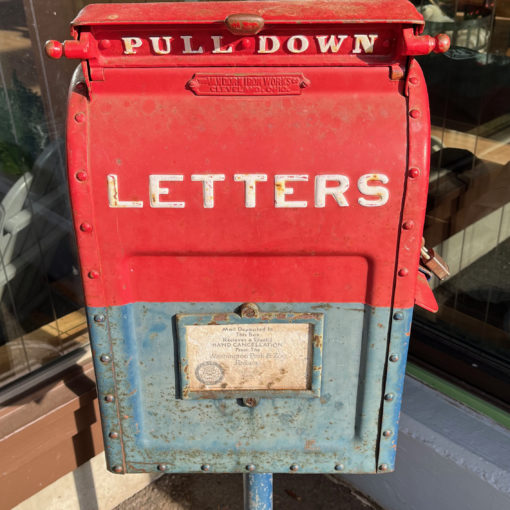 Photo of a historical mailbox at the Oregon Zoo showing all mail deposited is hand-canceled with the Washington Park & Zoo Railway stamp.